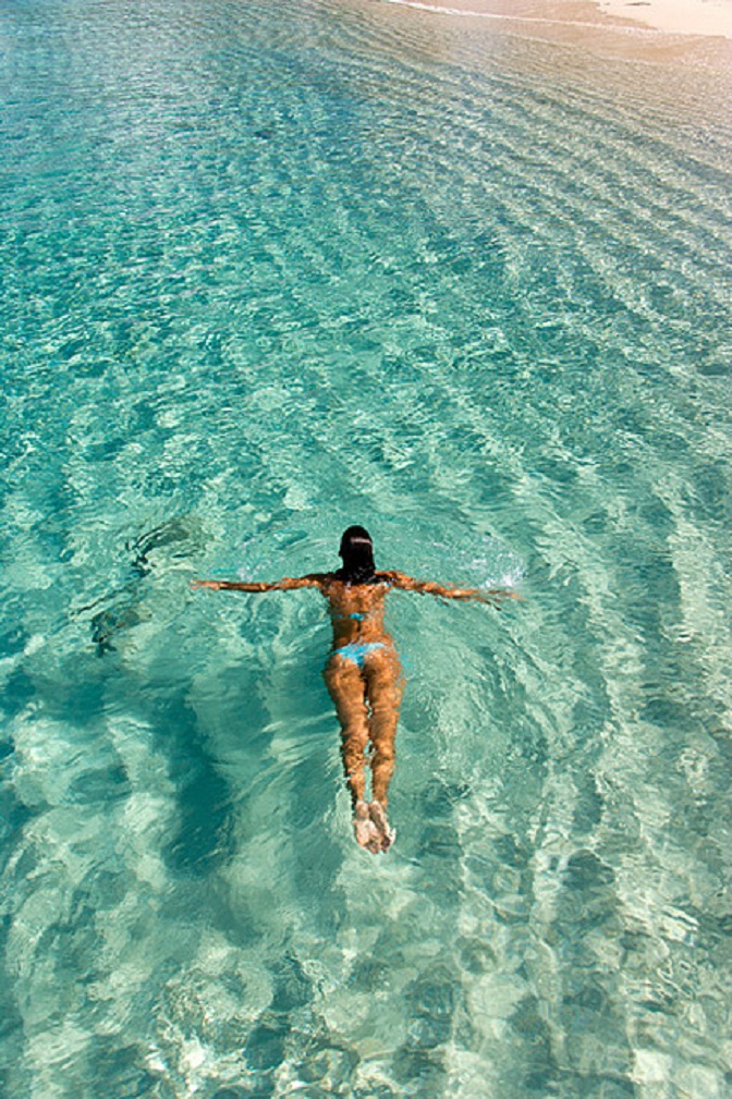girl-swimming-ocean-beach